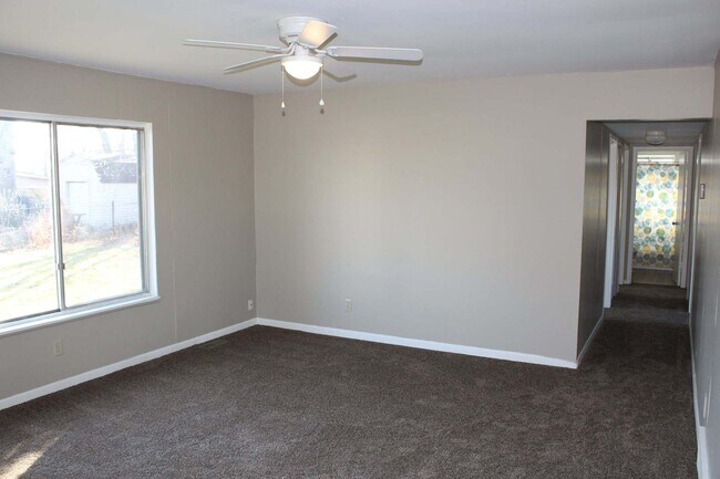 Building Photo - Freshly painted four bedroom ranch.