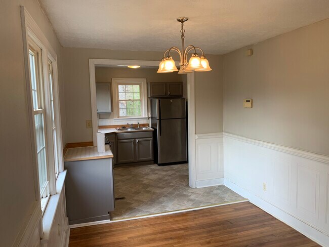 Dining into kitchen. - 1305 W Broadway