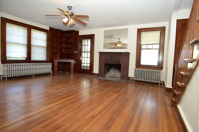 Original working fireplace and hardwood floor - 1680 Main St