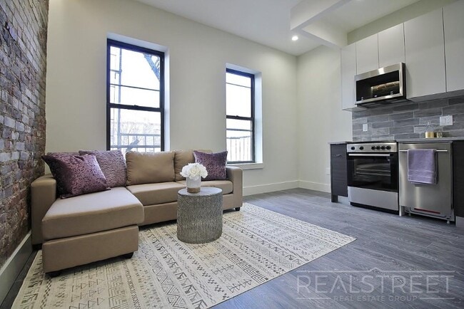 Building Photo - Spacious 2BR w/ Laundry, Pets OK, Backyard & Lounge | Steps to Brower Park & 3/4/C Trains