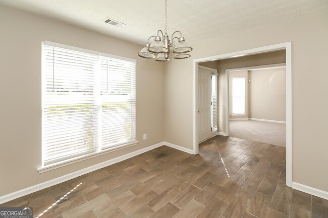 Building Photo - 6560 Commonwood Pl