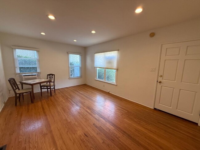 Living room with recessed ceiling lights. - 1755 Silver Lake Blvd