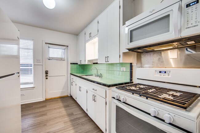 Mid Century Kitchen Restoration with new floors, paint, fixtures, freshly grouted and cleaned tiles. Appliances included Refrigerator, Gas Stove/ oven & built-in Microwave - 1551 W Agarita Ave
