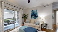 Located at 2742 Jeanetta Rd in Houston, TX, this well-appointed one-bedroom, one-bathroom residence offers a thoughtfully designed single-floor layout that maximizes every inch of its compact footprint. The open-concept living and dining area is anchored by rich hardwood flooring, crown molding, and a ceiling fan, creating a warm and inviting atmosphere. A sliding glass door floods the living space with natural light and opens onto a private balcony with stone-accented exterior views, perfect for relaxing outdoors. The galley-style kitchen is outfitted with dark espresso cabinetry, granite-look countertops, stainless steel appliances — including a refrigerator, range, microwave, and dishwasher — and continues the hardwood flooring for a cohesive look. The bedroom features a striking teal accent wall, plush carpeting, and a dedicated closet for ample storage. The full bathroom includes a tub/shower combination, hardwood-style flooring, and a vanity with storage. A dedicated laundry area with in-unit washer and dryer adds everyday convenience. A hallway connects the rooms efficiently, completing this comfortable and functional Houston residence.