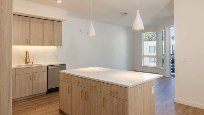 Kitchen with Stainless Steel Appliances and Quartz Countertops - Lorien