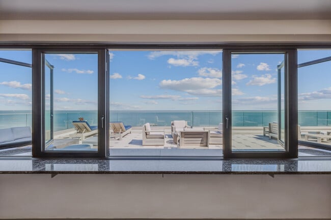 Oceanside outdoor patio at The Alexa Luxury Apartments in Corpus Christi, TX. - The Alexa Luxury Apartments I & II
