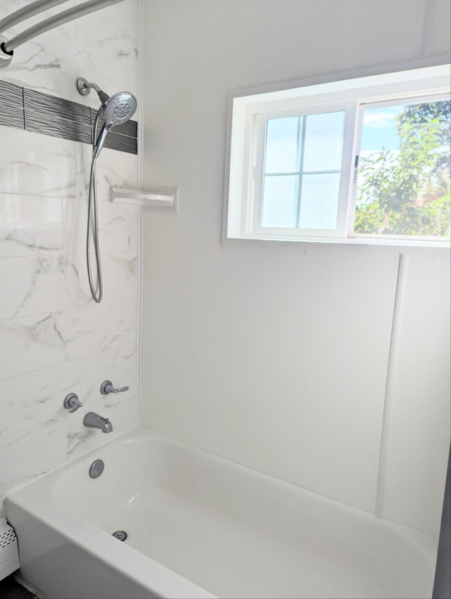 Bathroom with window looking out over the lake - 1587 Gull Ln