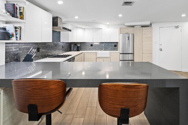 Building Photo - Live in one of San Diego’s most desirable locations in This award-winning architectural gem, "7 o...