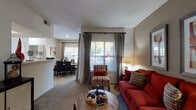 Located at 3100 Waterford Forest Cir in Cary, NC, this single-floor residence offers a well-designed layout that balances comfort and functionality. The open living area is carpeted and filled with natural light from large windows dressed with elegant drape panels, creating a bright and welcoming atmosphere. The space flows seamlessly into a dedicated dining area, separated by a half-wall pass-through, making it ideal for everyday living and entertaining.

The galley-style kitchen features light wood cabinetry, white appliances, ample counter space, and hardwood flooring, providing a clean and efficient workspace. Two full bathrooms complement the home — one with hardwood floors, a tub-shower combination, and a single-sink vanity, and another featuring a warm accent wall, a wide vanity with generous counter space, and a large mirror framed by overhead lighting.

Both bedrooms are carpeted and receive natural light through windows with outdoor views of surrounding greenery. Each room offers comfortable proportions with access to adjacent hallways and closet space. Textured ceilings are consistent throughout the home, adding a classic residential character. The overall ambiance is warm, functional, and inviting, making this Cary residence a practical and comfortable place to call home.