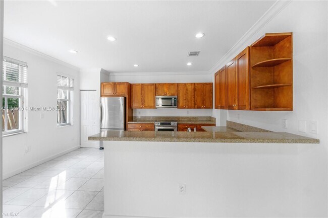 Foto del edificio - 4 br, 3.5 bath House - 10770 NW 74th Ln