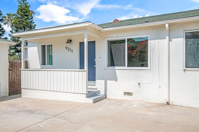 Front entrance with private seating area and parking - 9211 Earl St