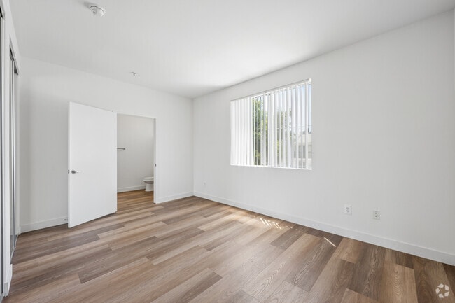 2BR, 2BA - 1040SF - Primary Bedroom - Northpoint Apartments at CSUN