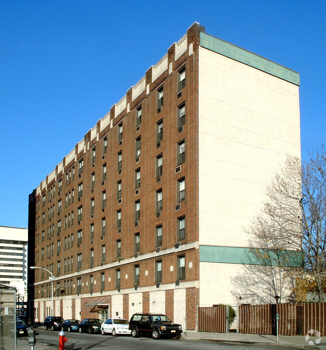 View from the southwest along Enos Place - Plaza Apartments