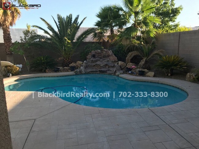 Building Photo - Rhodes Ranch  4 Bedrooms Pool  Guard Gated