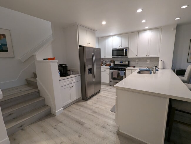 kitchen, stairs to 2nd floor - 20 Corsica Dr