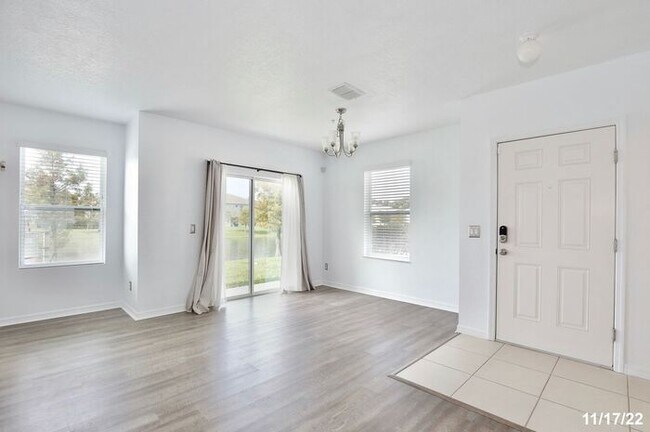 Building Photo - Spacious 3/2.5 Townhome with a 2 Car Garage and a Beautiful Pond View in Westwood Condos - Orlando!