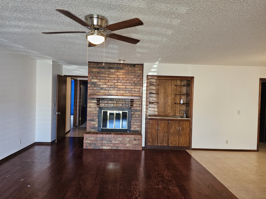 Livingroom with wood burning fireplace - 2104 NW 118th Ter