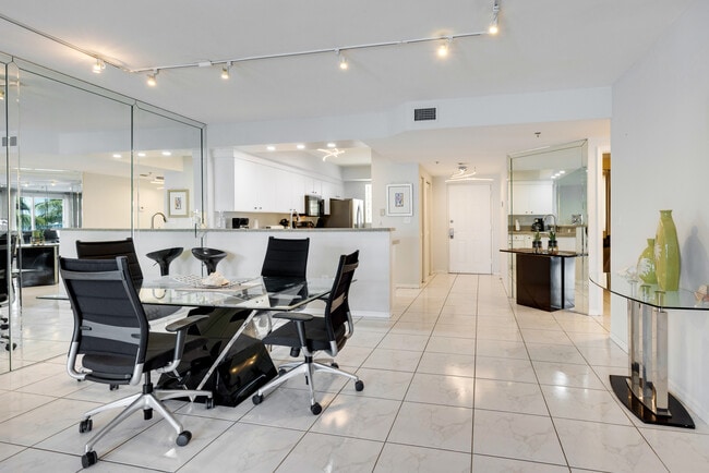 Dining Room's Glass Dining Table - 18260 N Bay Rd