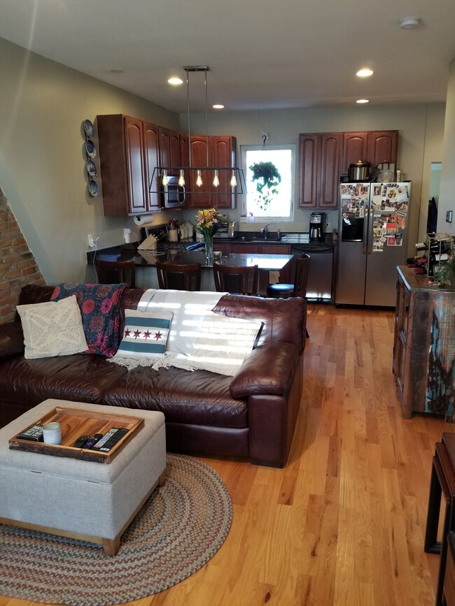 Living/dining/kitchen space. - 1231 31st St