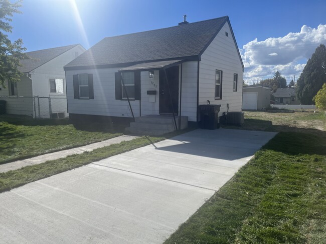 Front of house with concrete driveway - 1235 Ada Ave