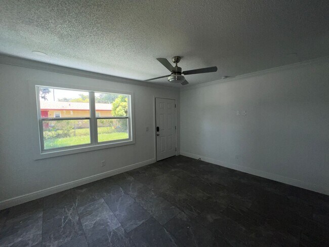 Building Photo - Fully Renovated 2 Bed, 1 Bath Duplex in the Heart of Kissimmee – Modern Upgrades Galore!