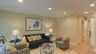 Located at 71 Mayfair Square Rd in Danbury, Connecticut, this well-appointed residence spans three floors, offering generous living space thoughtfully designed across multiple levels. The interiors reflect a refined aesthetic, with attention to architectural detail evident throughout. Crown molding and recessed lighting are among the notable finishing touches that lend the home a polished, sophisticated character.

The living area exemplifies the home's overall design sensibility, featuring warm neutral-toned walls that create a welcoming and versatile backdrop. Recessed ceiling lights provide even, ambient illumination, complementing the natural flow of the space. The hardwood flooring adds warmth and continuity underfoot, while the layout allows for comfortable furniture arrangements suited to both relaxed living and entertaining.

Crisp white baseboards and clean-lined crown molding frame each room with classic elegance. The multi-floor layout of the home provides distinct zones for living, sleeping, and additional functional spaces, offering both privacy and versatility for a variety of lifestyle needs. Each level contributes to the home's overall sense of spaciousness and livability. The cohesive interior palette and quality finishes throughout make this Danbury property a refined and functional place to call home.
