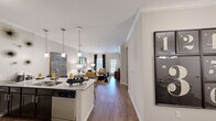Located at 12127 Dessau Rd in Austin, TX, this single-story, 3-bedroom, 2-bathroom home offers a well-designed open-concept floor plan that maximizes every inch of its comfortable footprint. The kitchen is outfitted with dark espresso cabinetry, granite countertops, a subway tile backsplash, and a full suite of stainless steel appliances, including a refrigerator, range, microwave, and dishwasher. Pendant lighting over the kitchen island adds a modern touch, while the space flows seamlessly into the dining area and living room — ideal for everyday living and entertaining. Crown molding and wood-style flooring run throughout the main living areas, lending a polished, cohesive aesthetic. The living room is bright and welcoming, with access to natural light through rear-facing windows and a glass door. The spacious primary bedroom features a ceiling fan, a closet with built-in shelving, and direct access to a bathroom with dark cabinetry vanity. Two additional bedrooms offer comfortable layouts with ample natural light. The secondary bathroom includes a full tub-shower combination with subway tile surround. A dedicated in-unit laundry area houses a full-size top-load washer and dryer, adding everyday convenience to this well-appointed Austin home.
