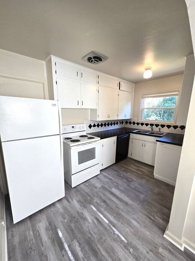 Photo - Great Location!  Updated, Two Car garage, Fenced Backyard ! Townhome