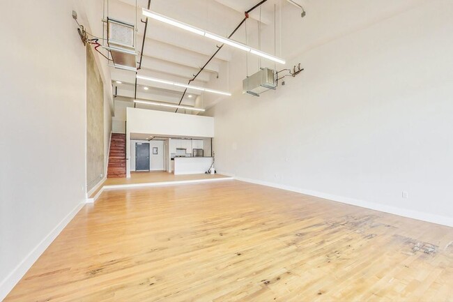 Building Photo - Beautiful loft with vaulted ceilings and l...