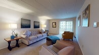 Located at 529 W Grand Ave in Dayton, Ohio, this single-floor unit offers a practical and comfortable layout designed for everyday living. The open-concept floor plan connects the living area to the kitchen, maximizing the sense of space throughout.

The living room is generously sized, featuring neutral-toned carpeting, a large sliding glass door with vertical blinds that allows natural light to fill the space, and room for a variety of furniture arrangements. Adjacent to the living area, the kitchen is well-appointed with white cabinetry offering abundant storage, dark-toned countertops, a full complement of appliances including an electric range and dishwasher, and durable tile flooring.

The unit includes multiple bedrooms, each carpeted and thoughtfully designed with closet access. The primary bedroom is notably spacious, featuring a large window with outdoor views, a walk-in closet with built-in shelving, and a connected en-suite bathroom equipped with a vanity and ample lighting. Additional bedrooms provide flexible space suitable for various uses, each with its own closet storage.

Overall, the unit presents a clean, functional aesthetic with neutral finishes throughout, offering a comfortable living environment in a residential Dayton neighborhood.