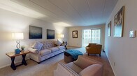 Located at 529 W Grand Ave in Dayton, Ohio, this single-floor unit offers a practical and comfortable layout designed for everyday living. The open-concept floor plan connects the living area to the kitchen, maximizing the sense of space throughout.

The living room is generously sized, featuring neutral-toned carpeting, a large sliding glass door with vertical blinds that allows natural light to fill the space, and room for a variety of furniture arrangements. Adjacent to the living area, the kitchen is well-appointed with white cabinetry offering abundant storage, dark-toned countertops, a full complement of appliances including an electric range and dishwasher, and durable tile flooring.

The unit includes multiple bedrooms, each carpeted and thoughtfully designed with closet access. The primary bedroom is notably spacious, featuring a large window with outdoor views, a walk-in closet with built-in shelving, and a connected en-suite bathroom equipped with a vanity and ample lighting. Additional bedrooms provide flexible space suitable for various uses, each with its own closet storage.

Overall, the unit presents a clean, functional aesthetic with neutral finishes throughout, offering a comfortable living environment in a residential Dayton neighborhood.