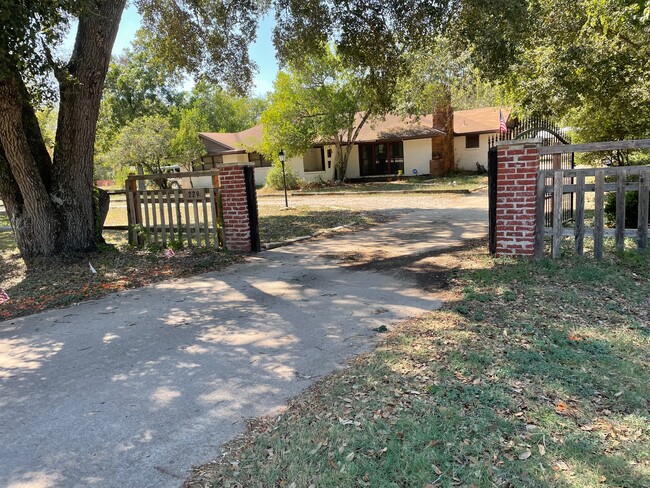 Front of the House Showing the Gate - 229 University Dr