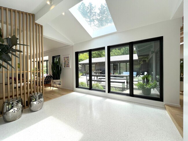 Building Photo - Sleek, Stylish & Surrounded by Green – The...