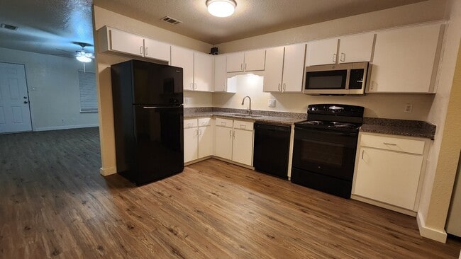 Recently new appliances including microwave and garbage disposal.  Refinished doors with moder pulls - 1110 Circle M Dr