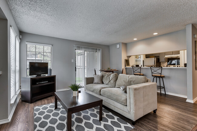 Contemporary Living Room Interior with Wood-Look Flooring - Las Brisas Apartments