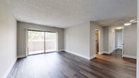 Located at 314 Echelon Rd in Voorhees, NJ, this thoughtfully updated 3-bedroom, 1-bathroom residence offers a comfortable and functional single-floor layout. The open living area is finished with rich hardwood-style flooring and features a textured ceiling, neutral gray walls, and a sliding glass door that fills the space with natural light and provides outdoor access. The well-appointed kitchen boasts warm wood cabinetry, white quartz countertops, a gray subway tile backsplash, and stainless steel appliances including a gas range and dishwasher, complemented by a window overlooking greenery. All three bedrooms are carpeted for comfort, with the primary bedroom offering a generous footprint and large windows with outdoor views. Two additional bedrooms provide ample closet storage, with one featuring dual built-in closets. The full bathroom is finished with large-format gray tile flooring, a white vanity with under-cabinet storage, a medicine cabinet mirror, and a soaking tub. A dedicated laundry area houses a stacked full-size washer and dryer unit, adding everyday convenience. Throughout, clean white trim and a neutral palette create a cohesive, move-in ready atmosphere.