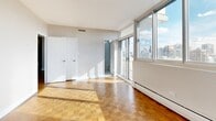 Located at 1212 De Pins O in Montréal's sought-after Golden Square Mile neighbourhood, this well-appointed 3-bedroom, 2-bathroom residence offers an generous and functional layout across a single floor. The entrance foyer sets a clean, welcoming tone with light tile flooring and a large built-in closet, leading down a bright hallway into the main living areas. Warm parquet wood flooring extends throughout the living and bedroom spaces, adding a classic character to the neutral, light-toned interior. The open combined dining and living room is expansive, bathed in natural light and providing an ideal space for both relaxing and entertaining. The galley-style kitchen is well-equipped with dark wood cabinetry, white quartz countertops, a subway tile backsplash, and stainless steel appliances, including a dishwasher, refrigerator, and range. Three well-proportioned bedrooms each feature parquet flooring, natural light from windows, and access to closet storage. The primary bedroom is notably spacious. Both bathrooms are finished in crisp white tile, one featuring a full bathtub with overhead shower. Three balconies and six closets throughout complete this practical and comfortable residence.