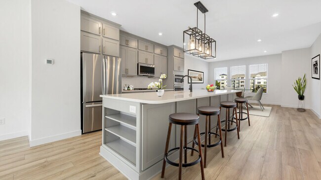 Kitchen area shown with virtual staging. Staging not included in listing. - 16531 Yellowwood Dr