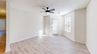 Located at 201 Tiliwa Ct in Clemson, SC, this single-floor, 3-bedroom, 2-bathroom home offers a practical and well-appointed layout throughout. Light wood-style flooring flows consistently across the living spaces, complemented by neutral wall tones and textured ceilings that create a clean, cohesive aesthetic.

The kitchen is a functional highlight, featuring granite countertops, white cabinetry, stainless steel appliances including a refrigerator, microwave, and range, as well as a double-basin sink. A peninsula-style breakfast bar separates the kitchen from the adjacent living area, which benefits from natural light through multiple windows and a glass-paneled exterior door. A ceiling fan adds comfort to the living room.

Each of the three bedrooms offers wood-style flooring and ceiling fans. The spacious primary bedroom includes a dedicated closet, while the additional bedrooms provide ample room for varied use. Three closets throughout the home offer generous storage options.

Both bathrooms are finished with granite vanity countertops, white cabinetry, and tub-shower combinations set on wood-style flooring. A dedicated laundry room with shelving and washer/dryer hookups adds everyday convenience to this well-designed Clemson home.