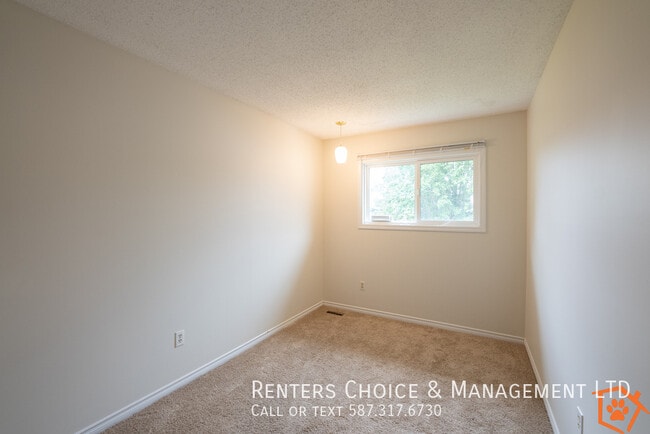 Building Photo - Townhouse featuring Extra Storage, Assigned Parking & Condo Amenities