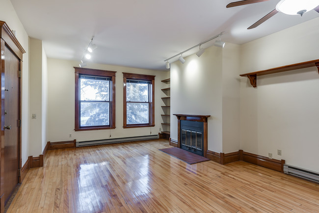 Living room wood burning fireplace. - 2417 Emerson Ave S