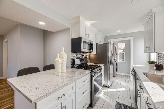 Building Photo - "Charming 3-Bed SFH Denver Gem with Gleaming Hardwood Floors"