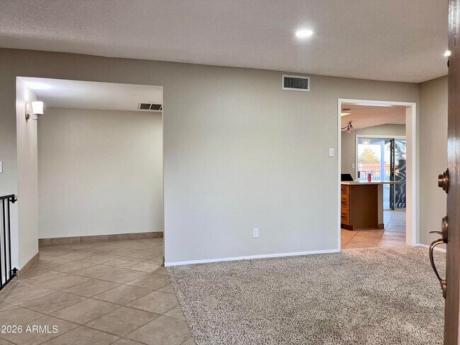 Entrance into hallway and kitchen areas - 11625 S Mohave St