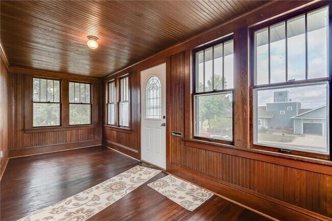 Heated Porch w/ French Doors Opening to Entertaining Area on First Floor - 353 E Main St