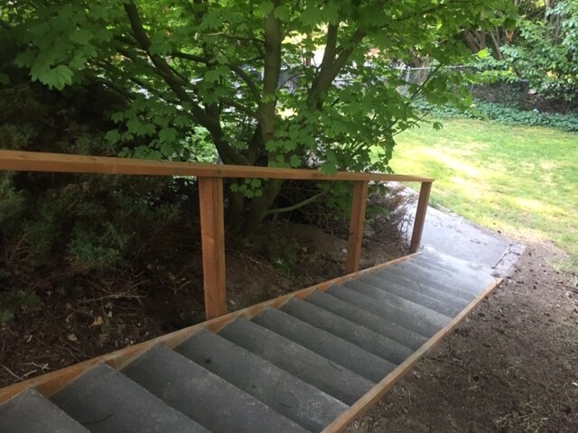 There are stairs and a new handrail from the driveway to the front door. - 6267 Northeast 203rd Place