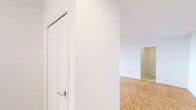 Located at 301 Dixon Road in Toronto, this well-appointed 2-bedroom, 1-bathroom unit offers a generous and thoughtfully laid-out floor plan. Warm parquet flooring flows consistently throughout the living areas and bedrooms, adding a classic, timeless character to the space. The bright and open living area is a highlight, featuring large floor-to-ceiling windows that flood the room with natural light and provide expansive outdoor views, with sliding glass doors leading directly to a private balcony. The kitchen is clean and modern, outfitted with white cabinetry, a subway tile backsplash, light tile flooring, and stainless steel appliances including a refrigerator and dishwasher. The primary bedroom is generously sized, with large windows overlooking the surrounding landscape, while both bedrooms benefit from dedicated closet spaces equipped with built-in hanging rods. The bathroom features a full soaker tub and shower combination, finished with crisp white subway tile surround and chrome fixtures. A hallway connects the rooms efficiently, contributing to a practical and comfortable flow throughout the unit. The overall aesthetic is clean, bright, and neutral, making it a versatile and move-in ready space.
