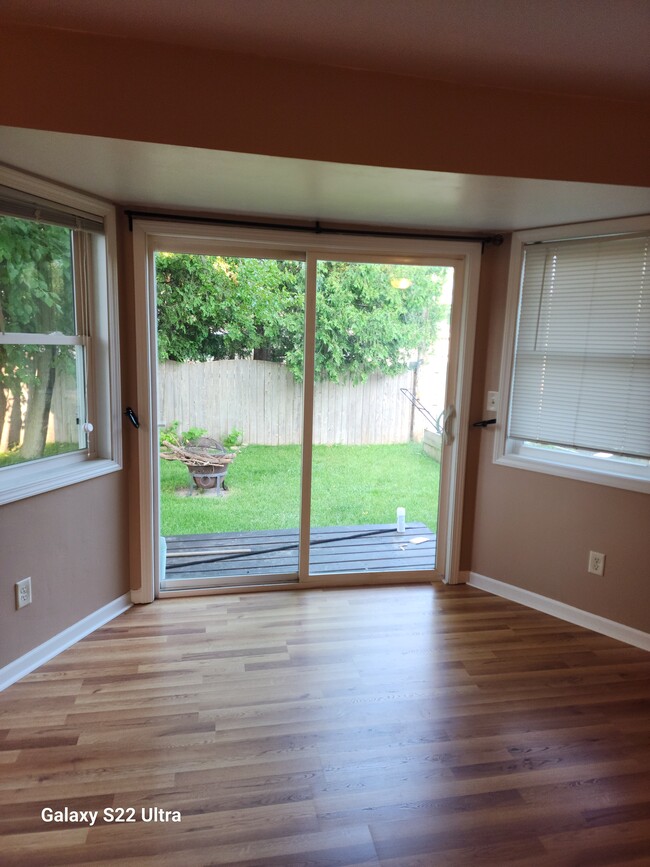 Back patio doors into fenced yard. - 54 Fairway Ct
