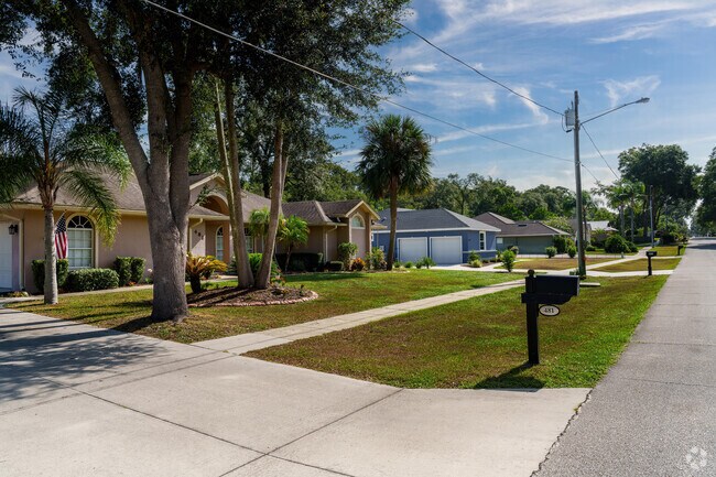 A row of scenic homes in Orange City displays pristine lawns and a clean look.