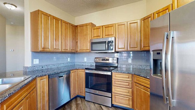 Entertain guests or cook your favorite dishes in this renovated kitchen in the 3-bed Milan. - Ridge Pointe Villas