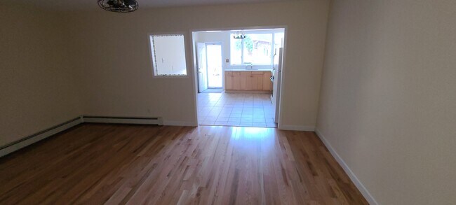 Spacious living room - 61 E Main St Apartments